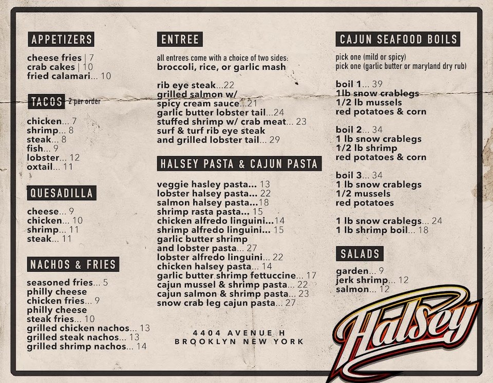 Printed menu beside a drink glass.
